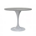 Table à manger ronde avec plateau en résine et piètement colonne en acier blanc